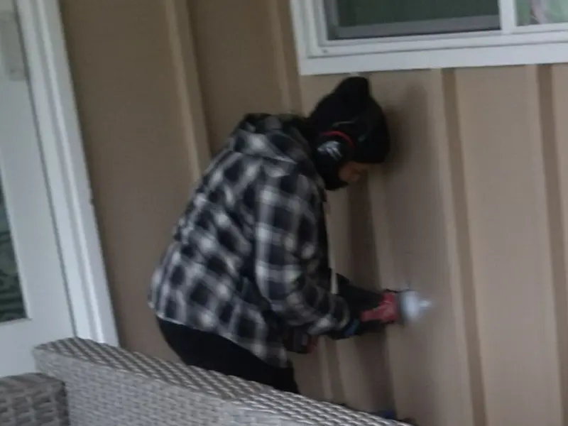 Professional electrician installing an exterior outlet in Lakeview Estates