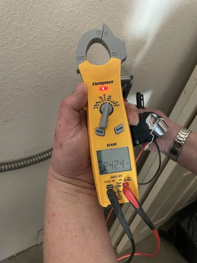 Voltage testing with clamp meter during Aluminum Wiring Replacement in Lakeview Estates
